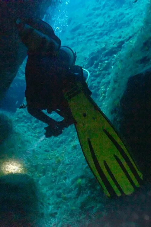 Diver leaving Cathedral Cave, Gozo